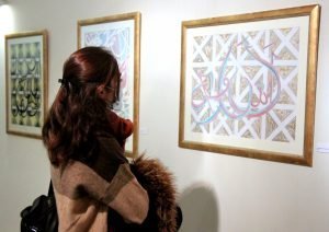 People at Noor Mukaddam's exhibition.